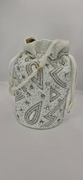 white and silver potli bag