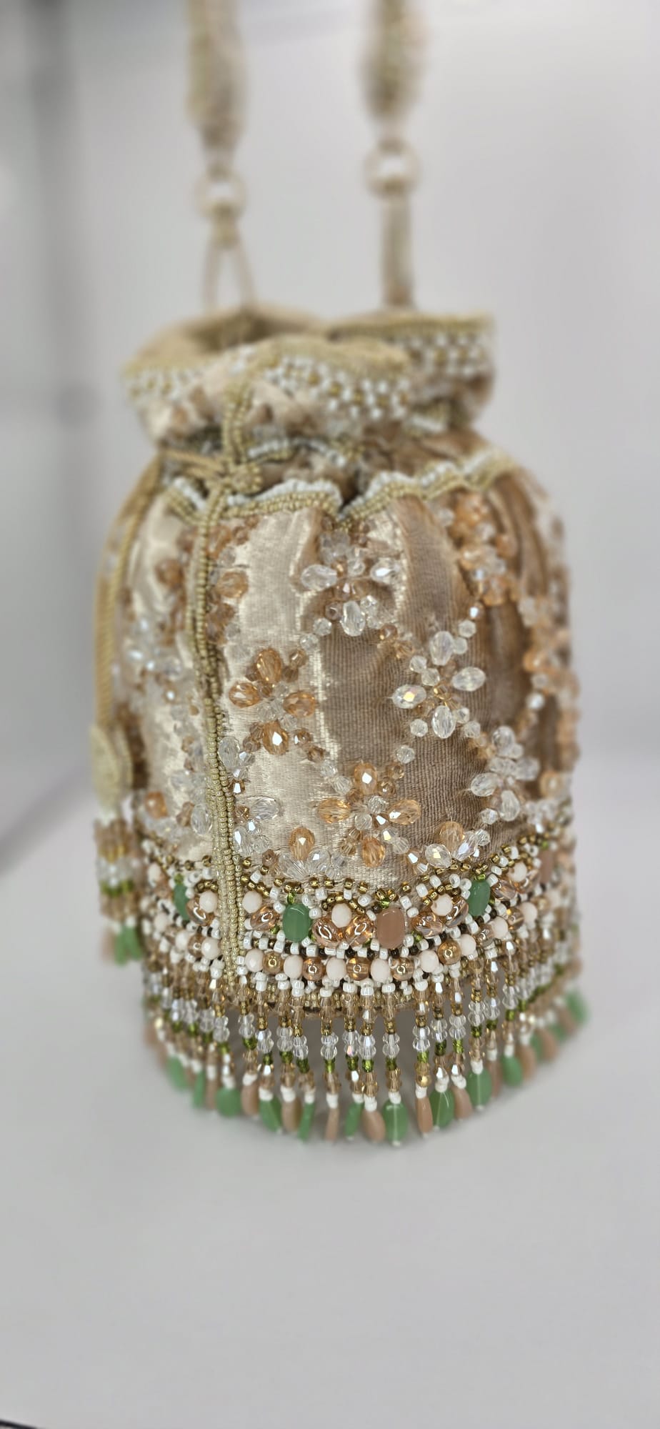 valvet beige potli bag