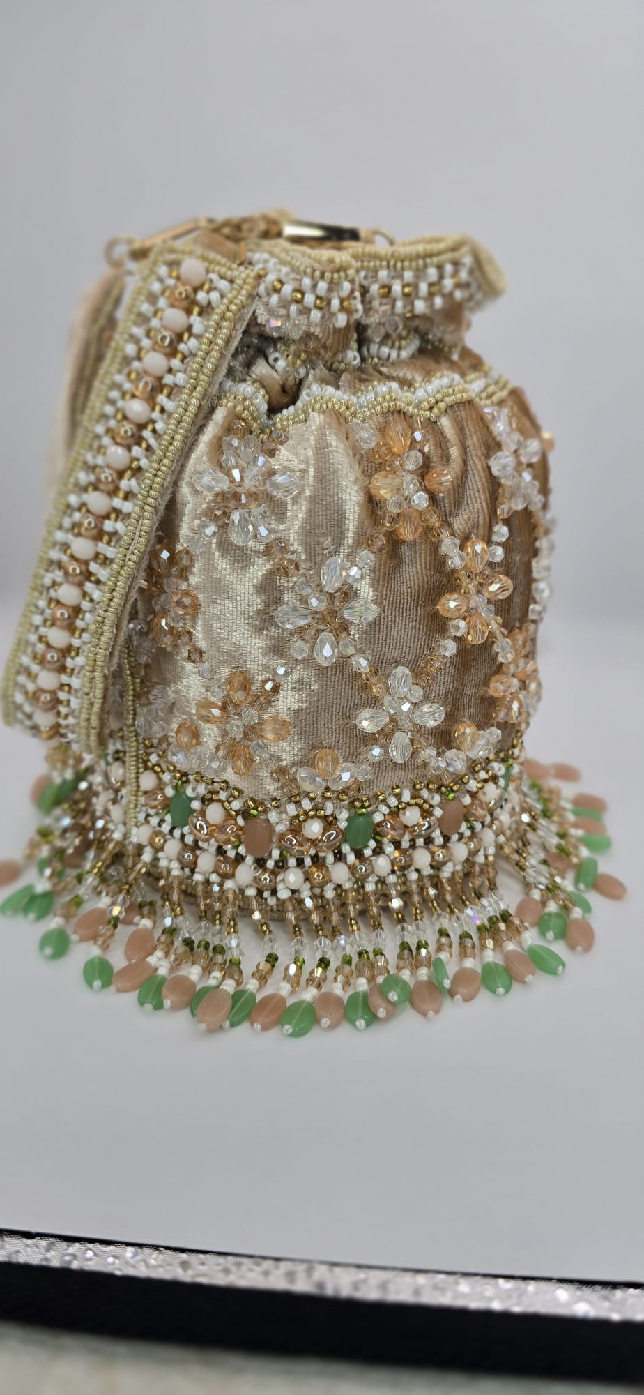 valvet beige potli bag