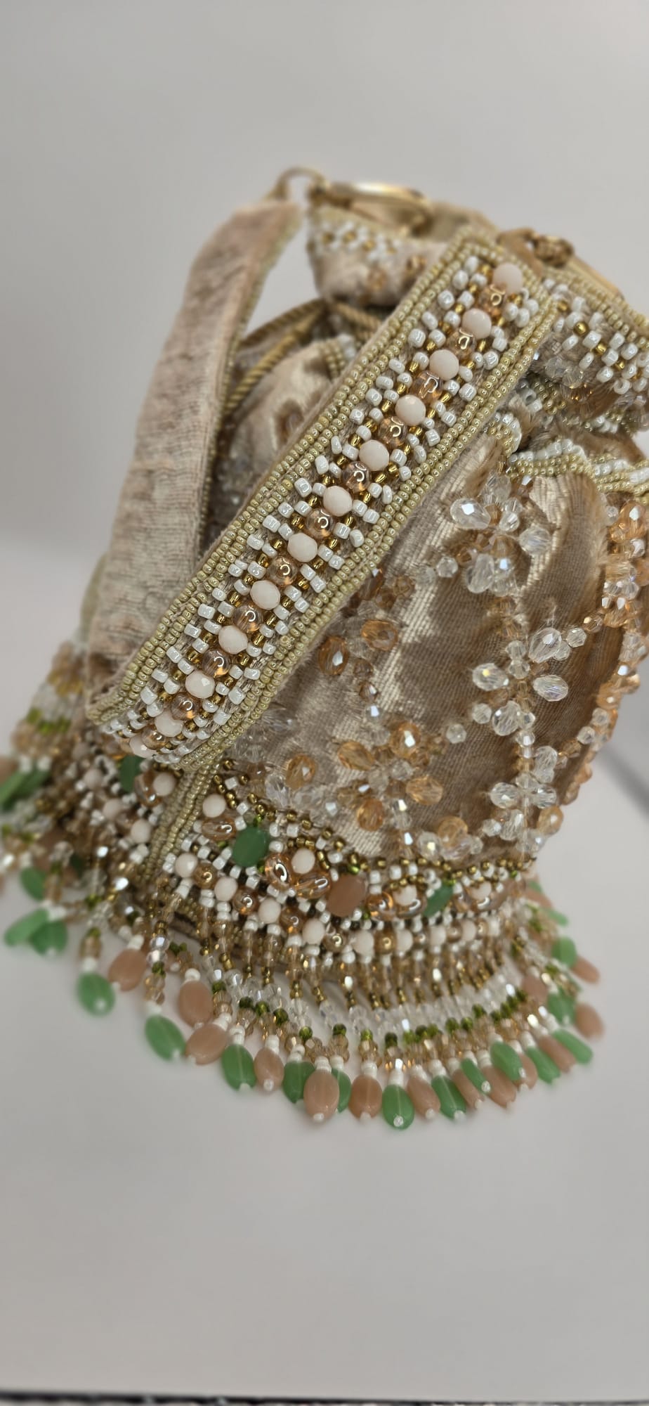 valvet beige potli bag
