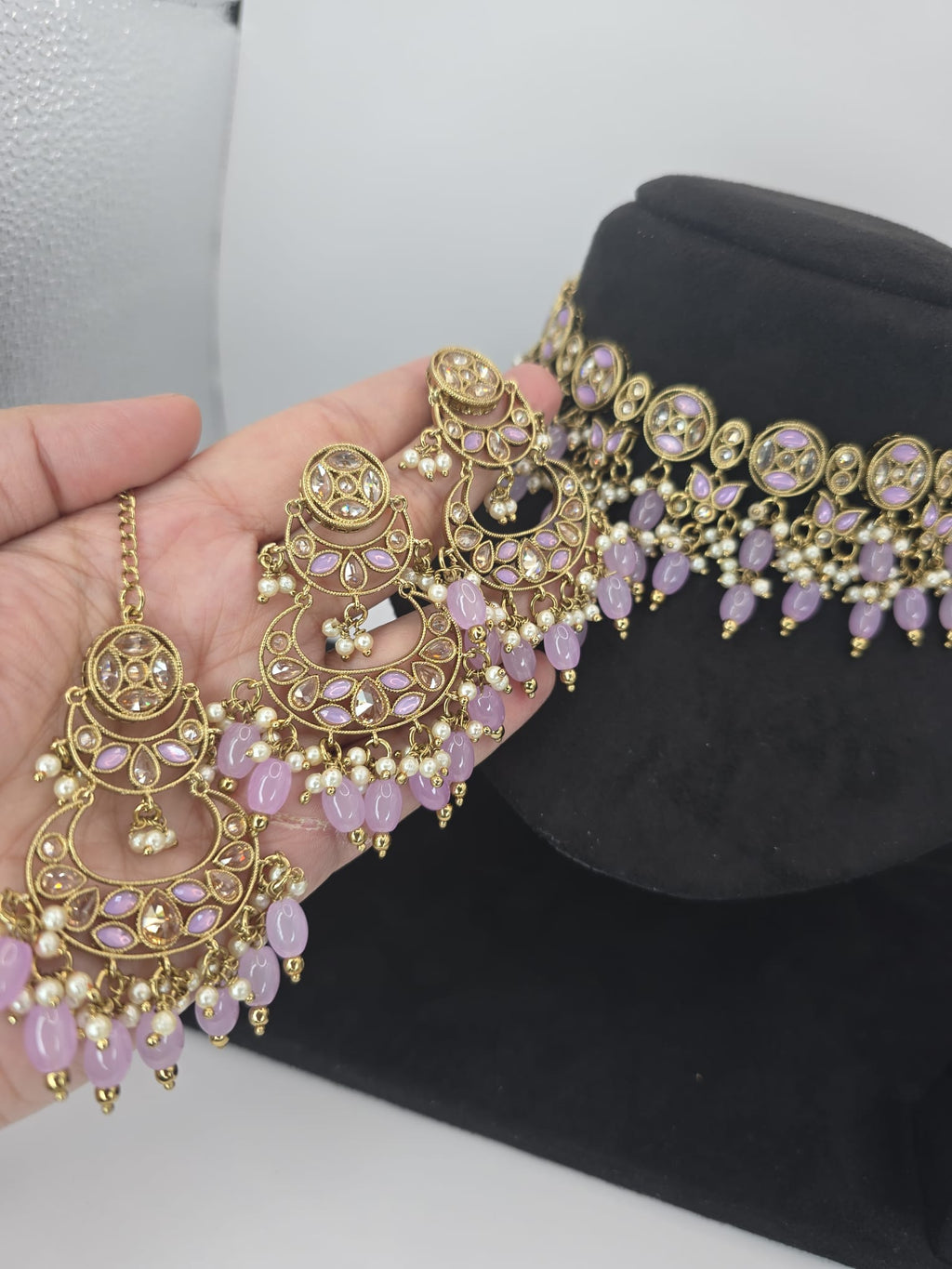 lilac choker with earings and tikka