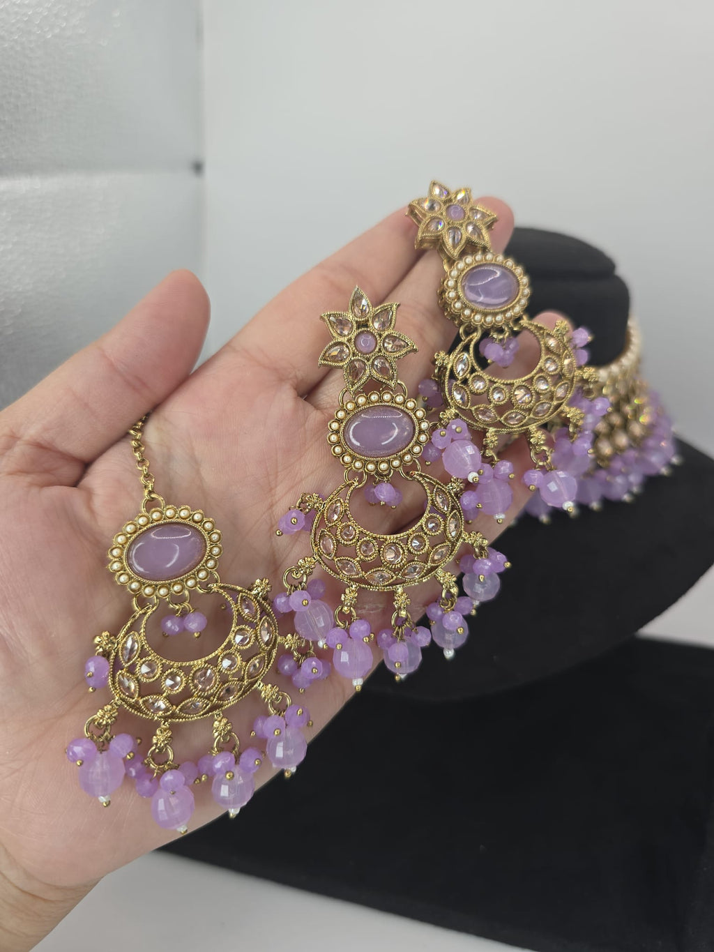 lilac choker with earings and tikka