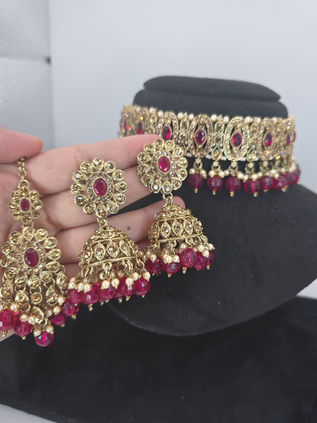 Hot pink choker set with jhumka earings and tikka